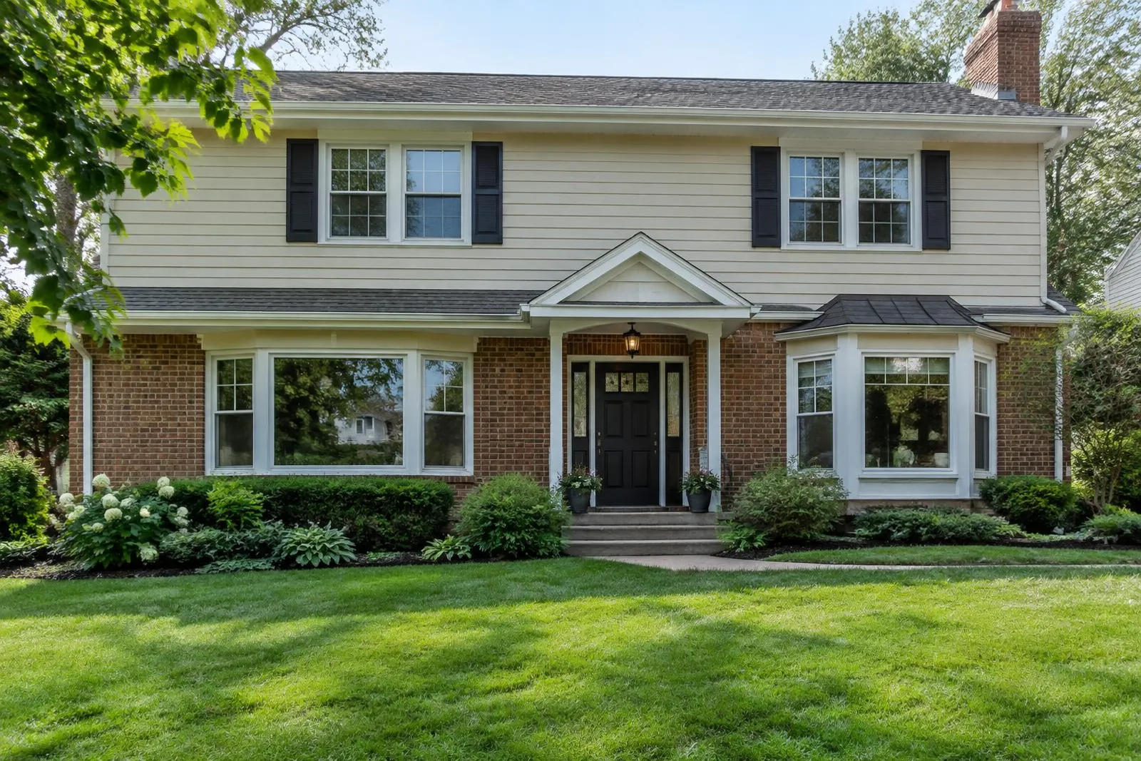 Suburban home with double-hung, casement, picture, and bay windows